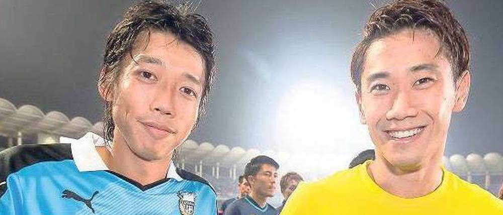 Beliebt. Borussia Dortmund ist derzeit auf Asia-Tour mit Kengo Nakamura (links) und Shinji Kagawa. Die Fußball-Bundesliga wird auch im Ausland gesehen und vermarktet. Bislang machen Ausstrahlungsrechte an Ländergrenzen halt. Kritiker wollen das ändern. 