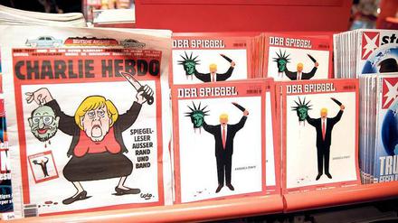 Schlachteplatte. Die aktuellen Cover von „Charlie Hebdo“ (links) und „Spiegel“.