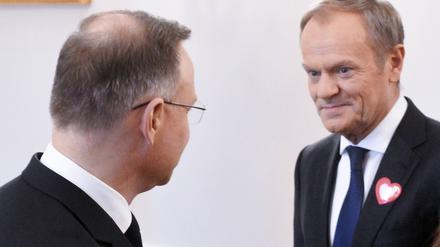 Polens neue Machtbalance: der künftige Regierungschef Donald Tusk (rechts) und Präsident Andrzej Duda aus dem PiS-Lager. 