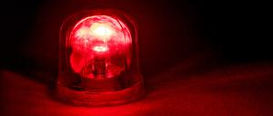 Emergency rotating alarm red light at night.