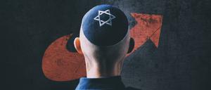 Jüdischer Mann trägt eine Kippa mit Davidstern auf dem Kopf vor AfD Logo