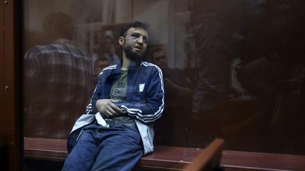 Dalerdjon Barotovich Mirzoyev suspected of taking part in the attack of a concert hall that killed 137 people, the deadliest attack in Europe to have been claimed by the Islamic State jihadist group, sits in the defendant cage as he waits for his pre-trial detention hearing at the Basmanny District Court in Moscow on March 24, 2024. A Russian court on March 24, 2024 ordered the continued detention of the first suspect in the Moscow concert hall attack that left more than 130 people dead. Moscow's Basmanny district court ordered Dalerdjon Barotovich Mirzoyev, a citizen of Tajikistan, to remain in custody until May 22 pending a terrorism investigation, according to a statement from Moscow city courts on Telegram. (Photo by TATYANA MAKEYEVA / AFP)