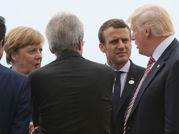 Europäer gegen Donald Trump: Kanzlerin Angela Merkel, Frankreichs Präsident Emmanuel Macron und der US-Präsident 