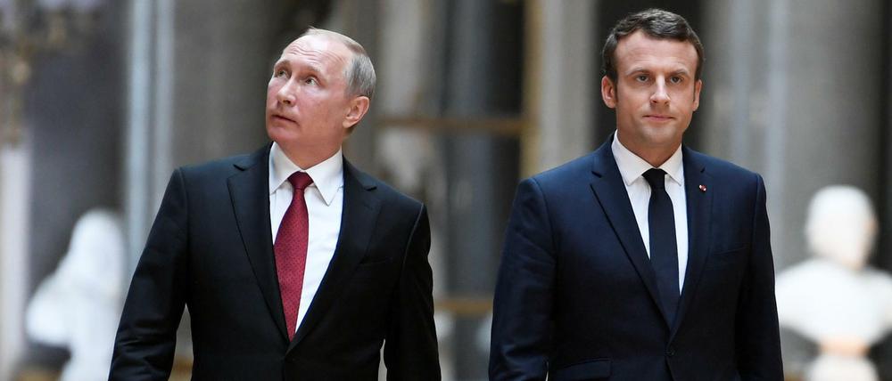 Empfang im Schloss Versailles. Wladimir Putin und Emmanuel Macron.