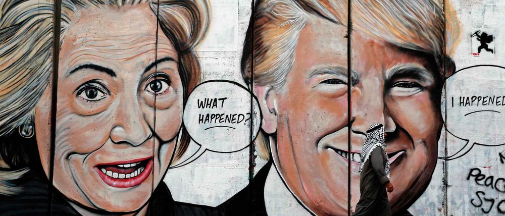 Graffiti-Porträts von Hillary Clinton und Donald Trump im Westjordanland. 