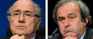 Da hilft wohl alles Flehen nicht. Für Sepp Blatter (l.) und Michel Platini wird es immer enger.