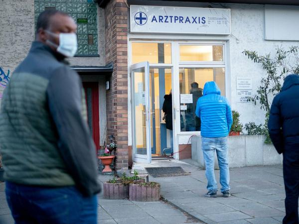 Patients waiting in front of a doctors office in Berlin to get tested.
