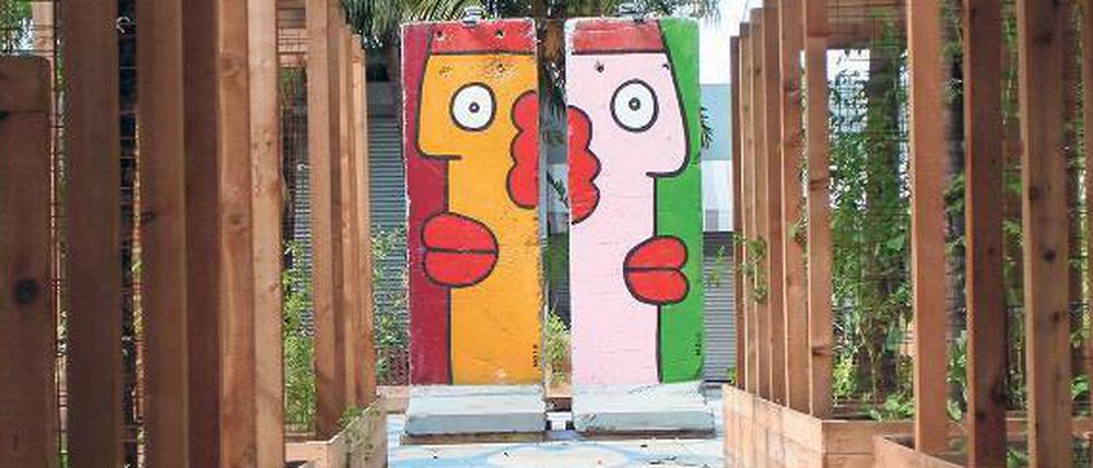 Das Bunte muss aufs Eckige. Diese von Thierry Noir bemalten Segmente der Berliner Mauer zieren den „Business Plaza“ des Ironside-District in Miami. Davor versucht man sich in Urban Gardening.