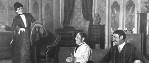 Szenenbild aus dem Residenz-Theater 1901. Die Schauspieler Richard Georg und Richard Alexander am Boden sitzend, daneben stehend die Schauspielerin Ida Becker.