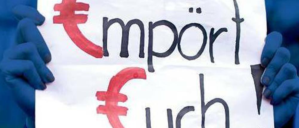 Lissabon: Demonstranten machen die Troika für Arbeitslosigkeit verantwortlich.