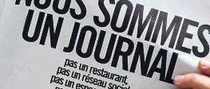 „Wir sind eine Zeitung“, mit dieser Schlagzeile protestiert die Redaktion der „Libération“ gegen die Umbaupläne. Foto: AFP