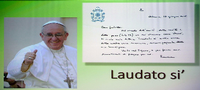 Ein Poster von Papst Franziskus. "Laudato si'" ist der Titel der Umwelt-Enzyklika. Foto: AFP