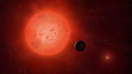 Illustration eines Roten Zwergsterns, umkreist von einem Planeten.