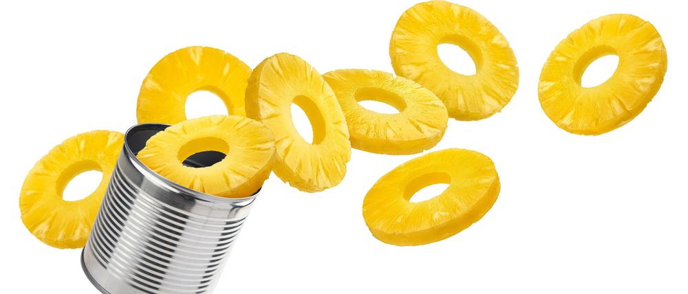 Canned pineapple rings isolated on white background.