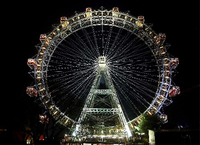 Das Riesenrad am Prater in Wien, hell erleuchtet vor dem Nachthimmel. Foto: dpa