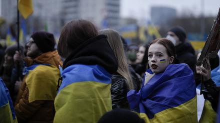 People attend a demonstration against Russia's war on Ukraine to mark the first anniversary of Russia's full-scale invasion of Ukraine, in Berlin, Germany, Friday, Feb. 24, 2023. (AP Photo/Markus Schreiber)