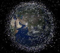 Das computergenerierte Bild der European Space Agency (ESA) zeigt Weltraummüll früherer Weltraummissionen, der neben intakten Satelliten um die Erde kreist. Foto: ESA/picture alliance/dpa