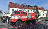 Feuerwehr am neuen Tröglitzer Flüchtlingsheim Foto: Hendrik Schmidt/dpa
