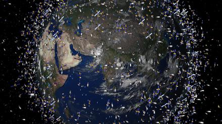 Das computergenerierte Bild der European Space Agency (Esa) zeigt Weltraummüll früherer Weltraummissionen, der neben intakten Satelliten um die Erde kreist. Im Orbit der Erde wird es immer voller. Metallteile schwirren um den Planeten und bergen Risiken für die Raumfahrt. Deshalb müssen sie entfernt werden.
