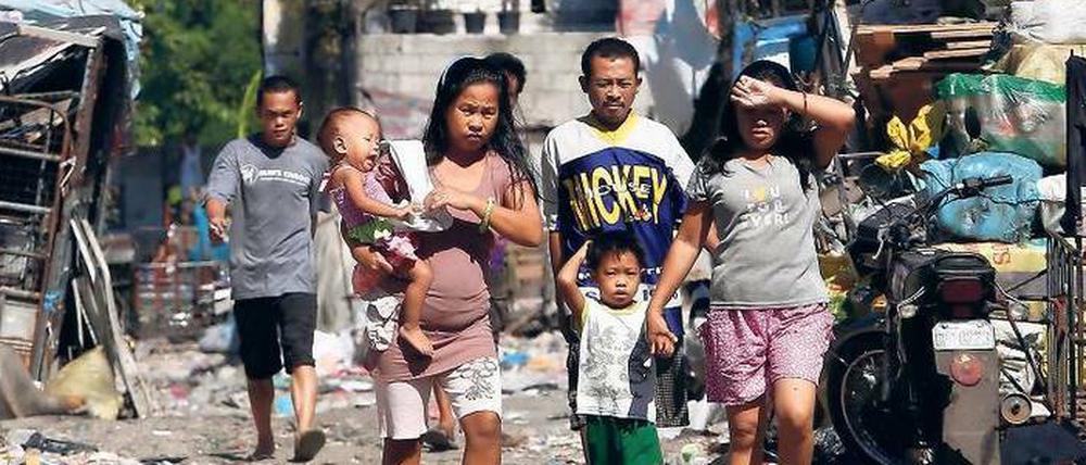 Weit weg von Bill Gates’ Garage. Slumbewohner in der philippinischen Hauptstadt Manila.