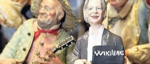 Frohes Fest. Julian Assange als Weihnachtskrippenfigur in Neapel. 