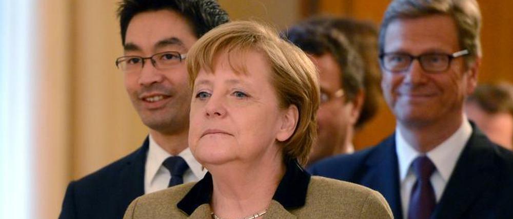 Angela Merkel (CDU), Philipp Rösler und Guido Westwelle (beide FDP).