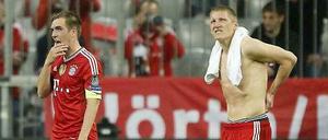 Sehen so Weltmeister aus? Die sichtlich geknickten Nationalspieler Bastian Schweinsteiger und Philipp Lahm nach dem Champions-League-Aus gegen Real Madrid.
