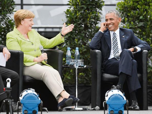 Bundeskanzlerin Angela Merkel (CDU) und Ex-US-Präsident Barack Obama diskutieren auf dem Deutschen Evangelischen Kirchentag.