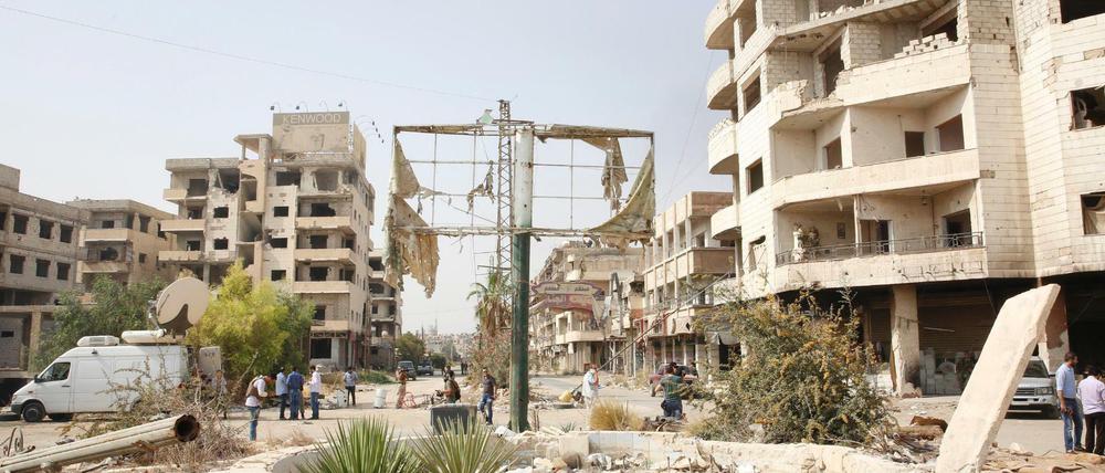 Zerstörte Häuser wie hier in Darayya bei Damaskus sind in vielen Städten in Syrien zu sehen. 