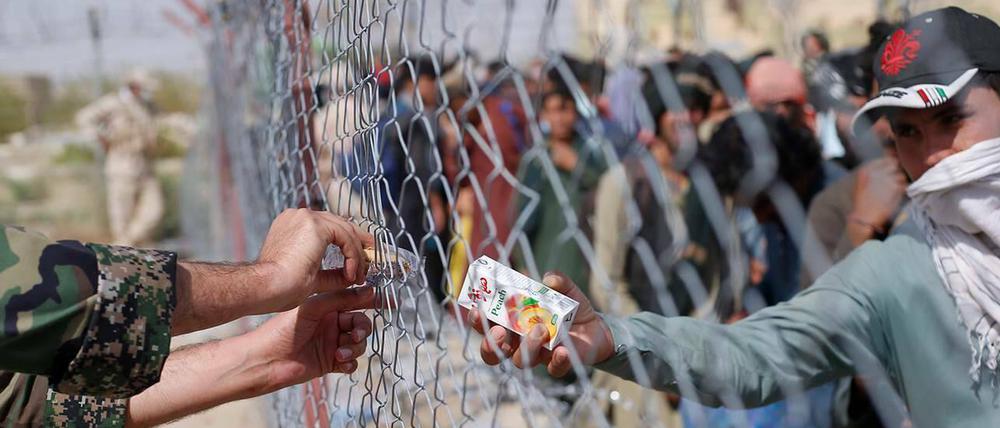 Politische Krise mit Auswirkungen auf Europa. Afghanische Flüchtlinge am 21. August an der afghanisch-iramischen Grenze in Sistan-Balochistan. 