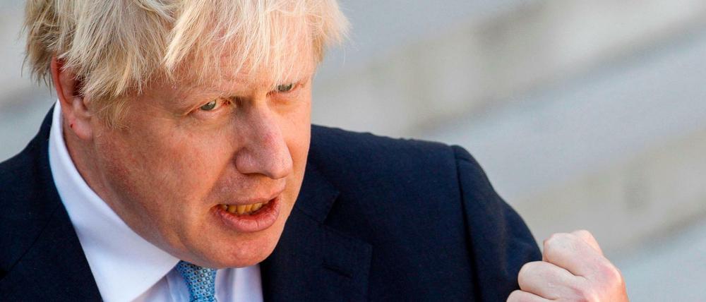 (FILES) In this file photo taken on August 22, 2019, Britain&amp;apos;s Prime Minister Boris Johnson speak to the press ahead of a meeting at The Elysee Palace in Paris, with French President Emmanuel Macron. - British Prime Minister Boris Johnson announced August 28, that the suspension of Britain&amp;apos;s parliament would be extended until October 14 -- just two weeks before the UK is set to leave the EU -- enraging anti-Brexit MPs. MPs will return to London later than in recent years, giving pro-EU lawmakers less time than expected to thwart Johnson&amp;apos;s Brexit plans before Britain is due to leave the European Union on October 31. (Photo by GEOFFROY VAN DER HASSELT / AFP)