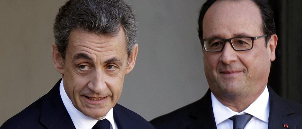 Präsident Francois Hollande (rechts) und Ex-Präsident Nicolas Sarkozy nach ihrem Krisengespräch im Elysee-Palast in Paris.