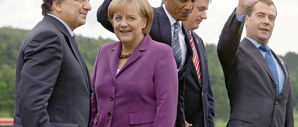 Angela Merkel mit dem russischen Präsidenten Medwedew (li.) und dem britischen Premier David Cameron. 