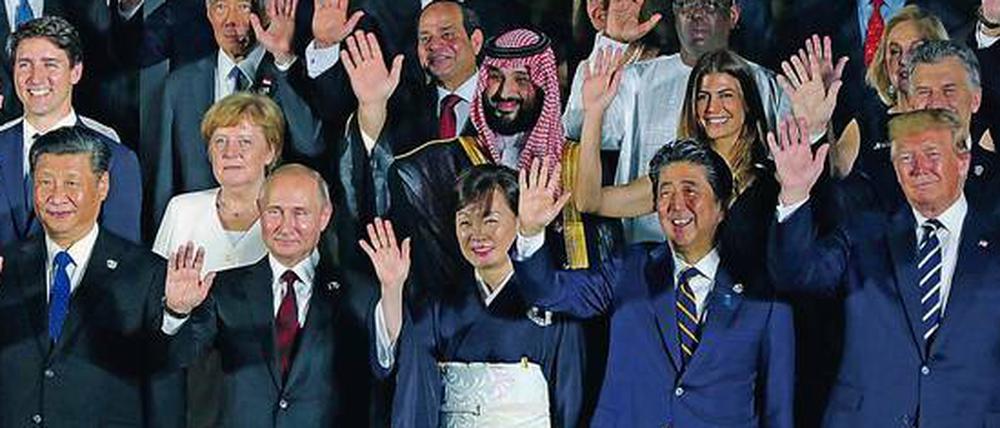 Winken allein reicht nicht. Gruppenbild der Regierungschefs beim G20-Gipfel im Juni in Osaka.