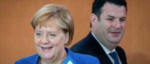 Angela Merkel (CDU) und Hubertus Heil (SPD)