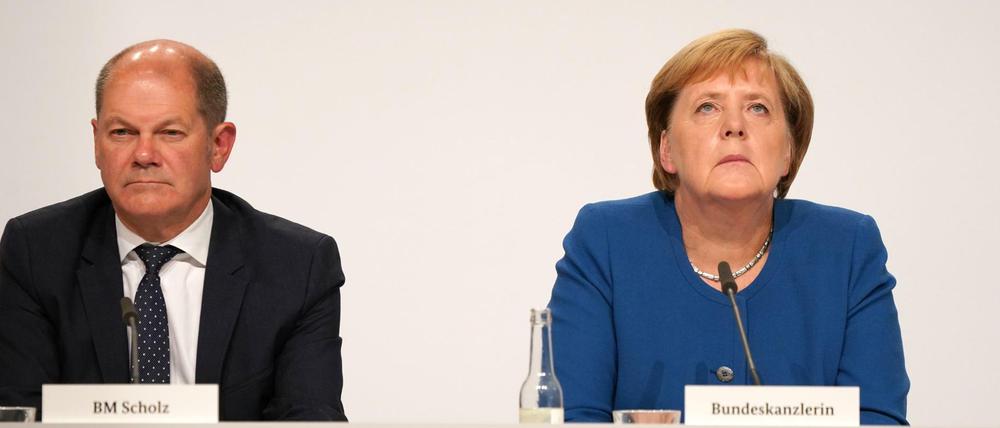 Kanzlerin Angela Merkel (CDU) und Finanzminister Olaf Scholz (SPD) standen bei den Klimaverhandlungen unter Druck.