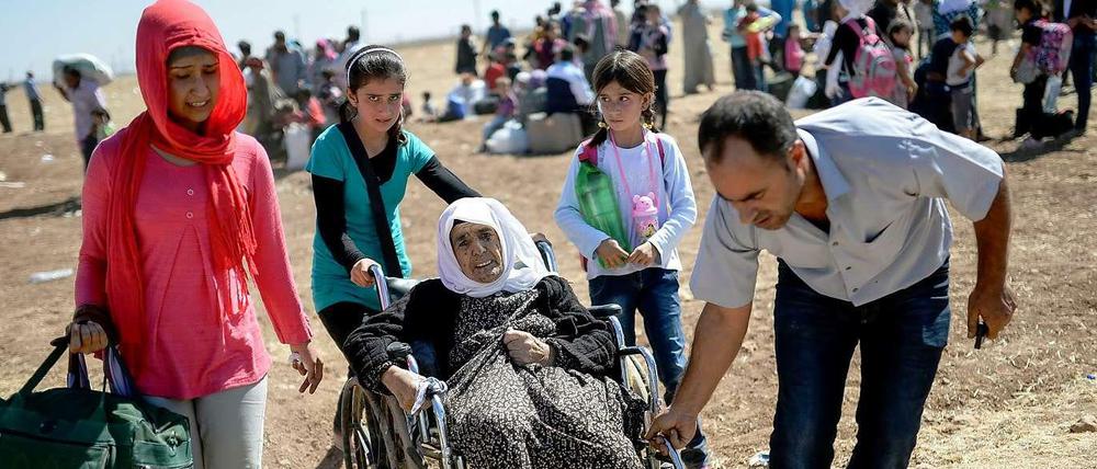Ohne Heimat, ohne Hoffnung: Wie hier an der türkischen Grenze sind syrische Flüchtlinge auf Hilfe angewiesen. Das gilt auch für die Aufnahmestaaten.