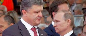 Keine Freunde: Petro Poroschenko und Wladimir Putin bei den D-Day-Feierlichkeiten in diesem Jahr in Frankreich.