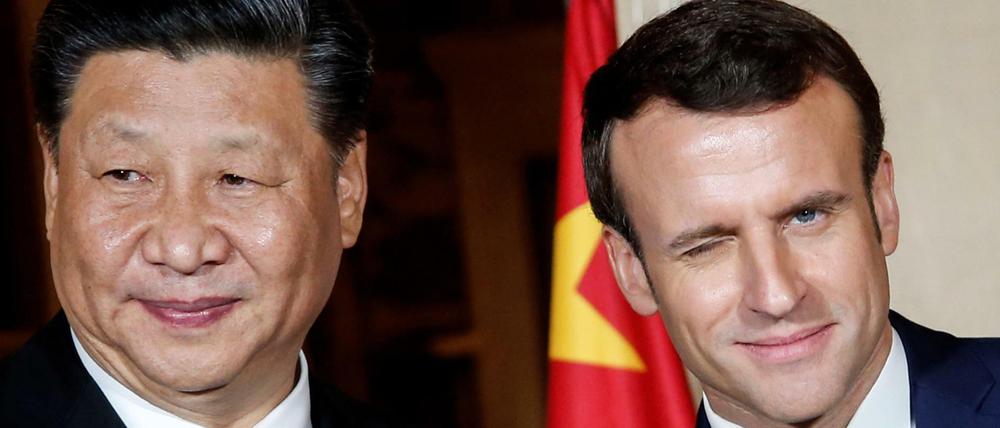 Frankreichs Präsident Emmanuel Macron mit Chinas Präsident Xi Jinping. 
