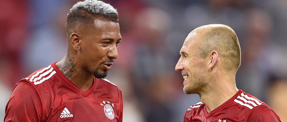 Verstehen sich gut beim FC Bayern München. Jerome Boateng und Arjen Robben.