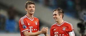 Grund zur Freude schon vor der WM. Thomas Müller (l.) und Philipp Lahm bleiben noch jahrelang beim FC Bayern München.