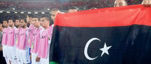 Flagge zeigen. Libyens Nationalspieler vor ihrem Eröffnungsspiel beim Afrika-Cup gegen Äquatorialguinea. 