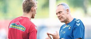 Die Torgefahr in Person. Nils Petersen (l.) mit Freiburgs Trainer Christian Streich. 