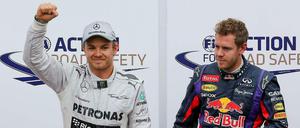 Nico Rosberg und Sebastian Vettel stehen vor Fotografen.