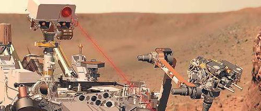 Fahrbare Forschungsstation. Mit einem Laserstrahl soll der Marsrover Gestein abtasten. Material wird mit einem Roboterarm gesammelt und in Minilaboren analysiert.